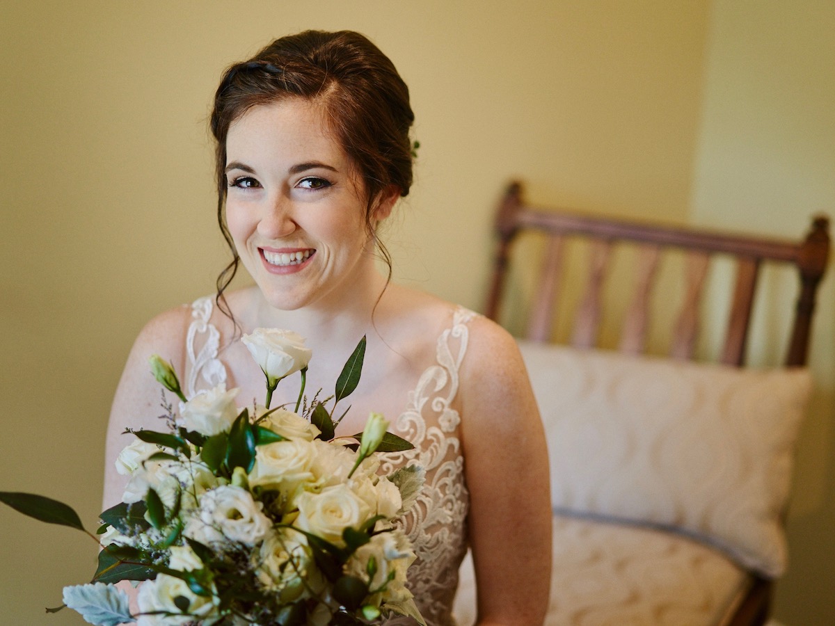 Lovely bride with white bouquet